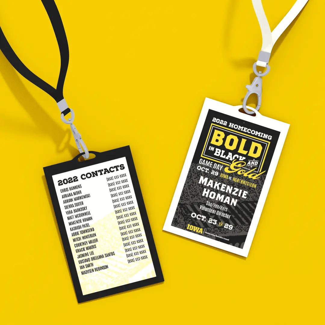 Mockup of homecoming committee lanyards. The front has the same dark background as the other materials with the 
                        wordmark at the top and the member's name and title below that in the same fonts as the wordmark. It also includes the dates 
                        of homecoming week and gameday information. The back of the lanyard is a cream background with the Kinnick stadium overlay. 
                        It includes 2022 Contact information for members.