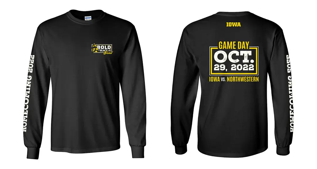 Mockup of a black colored long-sleeve t-shirt printed in white and gold with the homecoming logo on the lapel, the 
                        Iowa logo on the sleeve, and gameday information on the back in a bordered box.