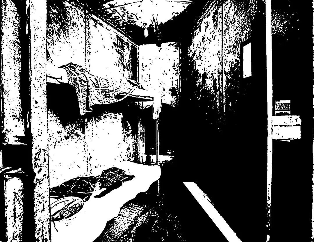 Forth spread of the zine. It's a full spread black and white posterized image of one of the jail cells. 
                        It's wedge shaped and the back of the cell is very narrow. It has bunk beds on the left.